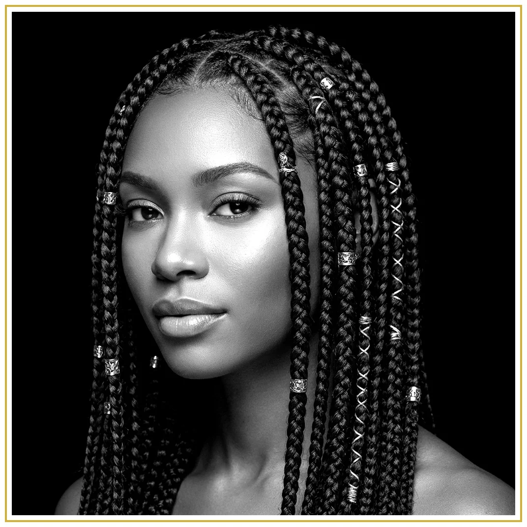 Beautiful Black woman with intricate, luxurious braids